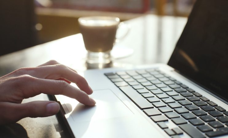 using computer, check e-mail in the morning